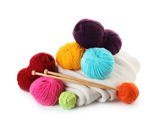 Photo of Different yarns, knitting needles and sweater isolated on white