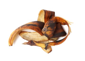 Photo of Banana peel with dark spots isolated on white, top view