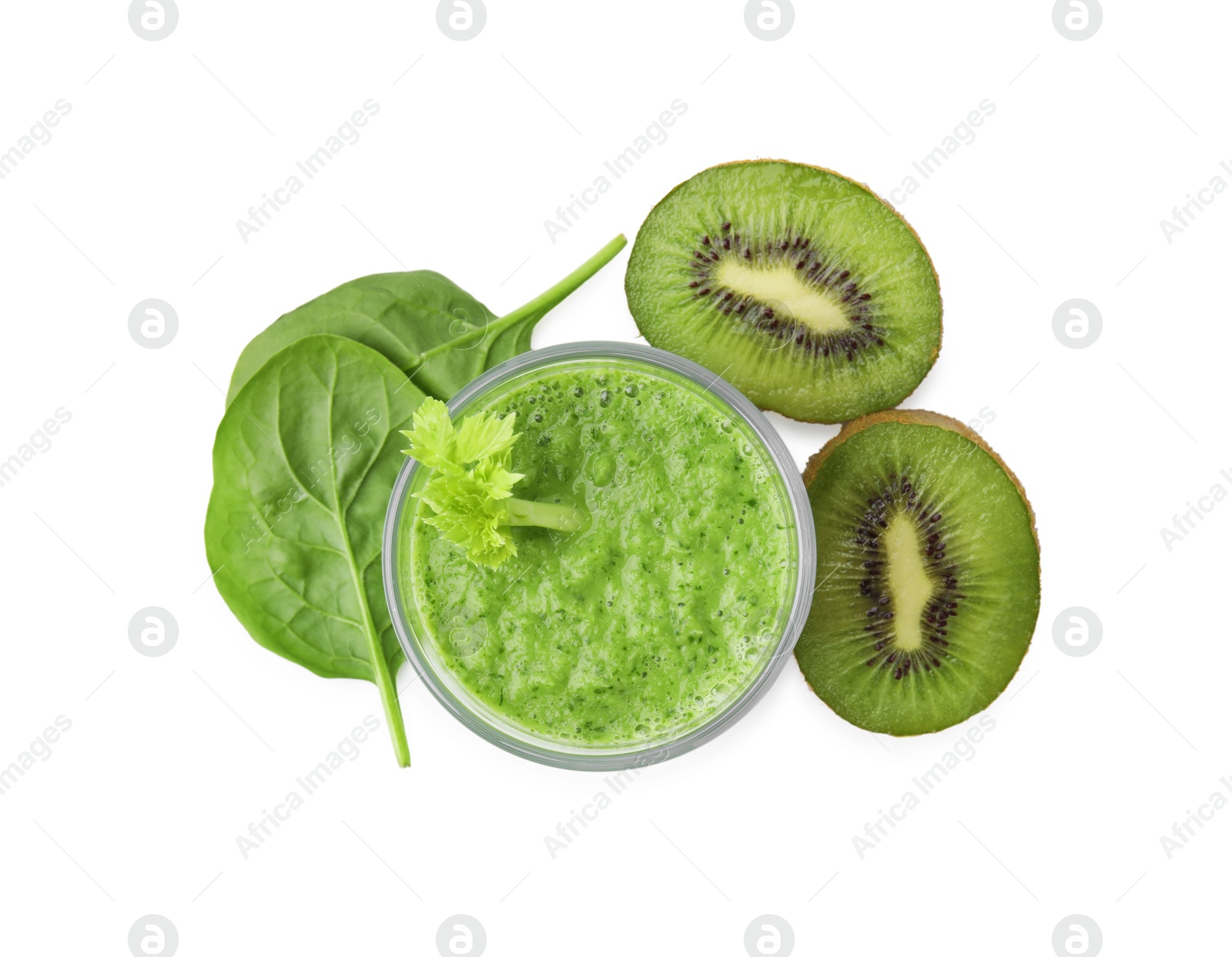 Photo of Tasty green smoothie in glass, spinach and halves of kiwi isolated on white, top view