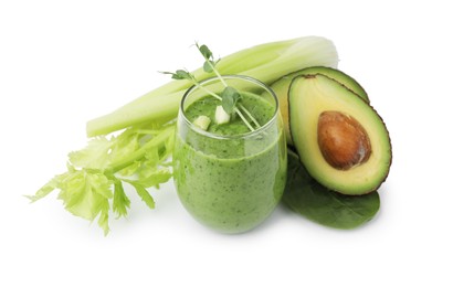 Photo of Tasty green smoothie in glass , avocado and celery isolated on white