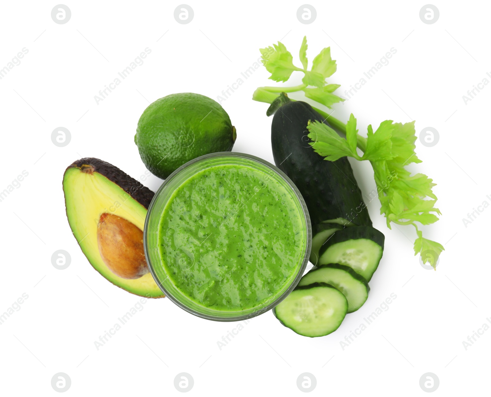 Photo of Tasty green smoothie in glass, cucumber, lime and avocado isolated on white, top view