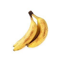 Bunch of ripe bananas with dark spots isolated on white, top view