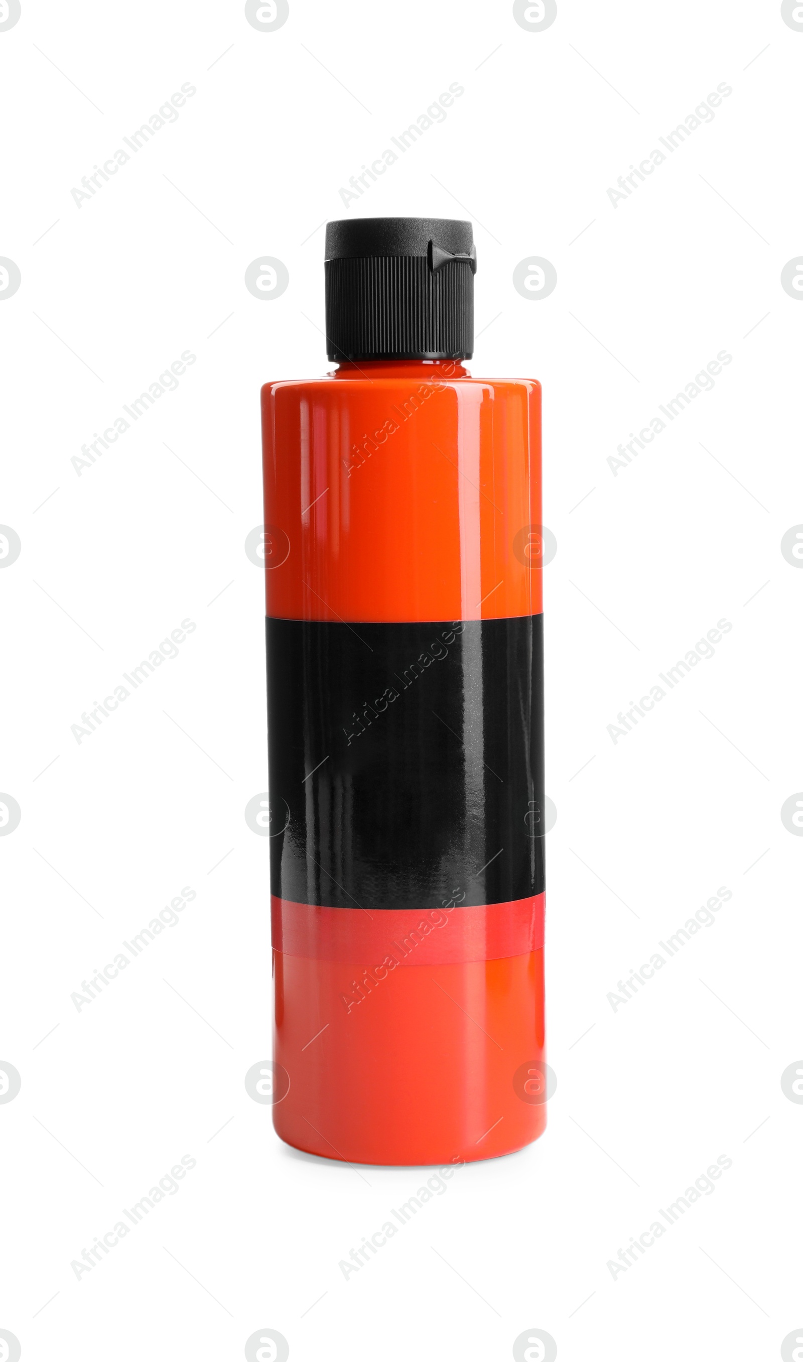 Photo of Orange acrylic paint in bottle isolated on white