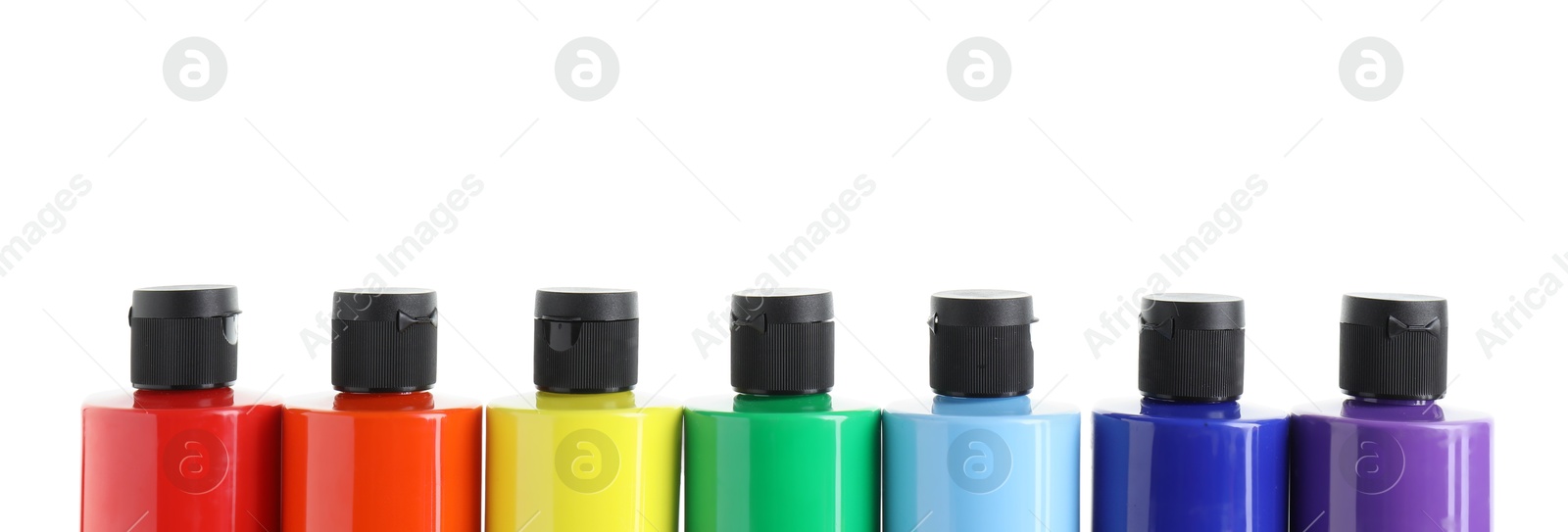 Photo of Acrylic paints of different colors in bottles isolated on white