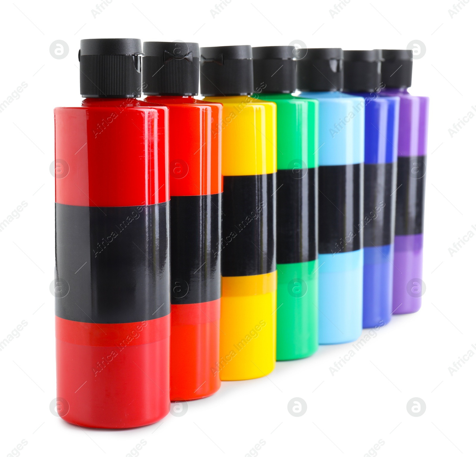 Photo of Acrylic paints of different colors in bottles isolated on white