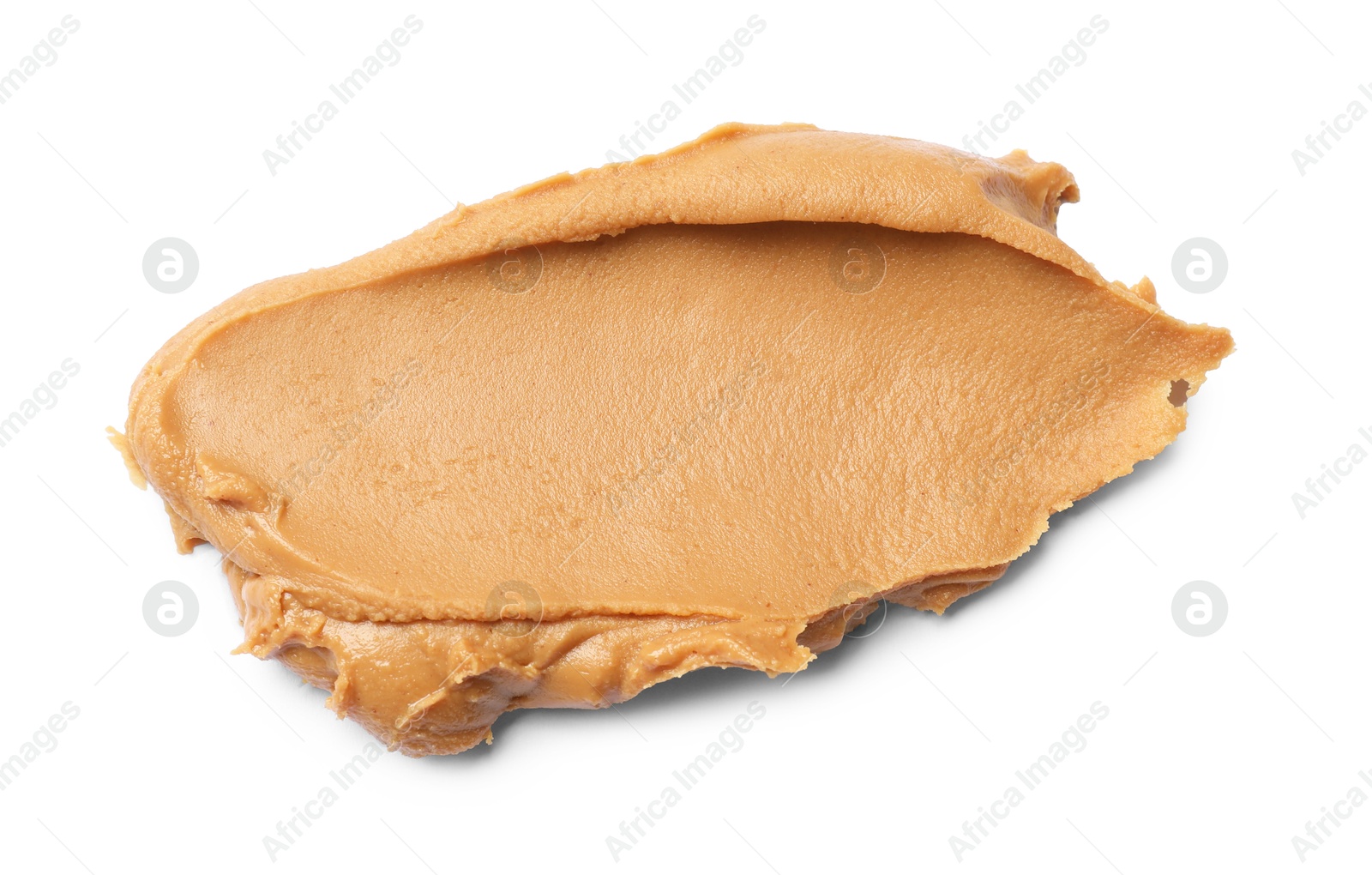 Photo of Tasty peanut butter on white background, top view