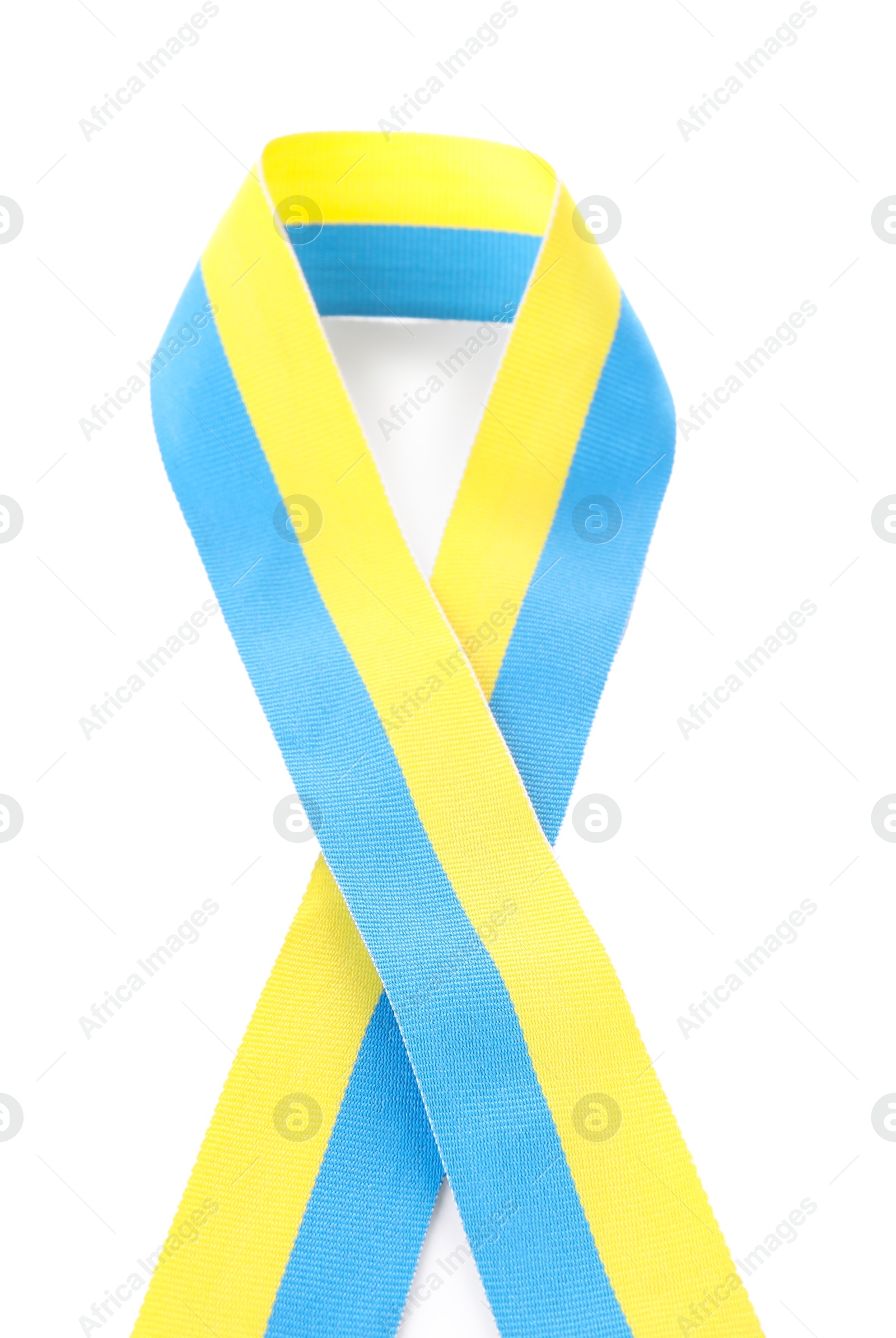 Photo of Ribbon in colors of Ukrainian national flag isolated on white, top view