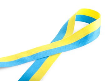 Photo of Ribbon in colors of Ukrainian national flag isolated on white