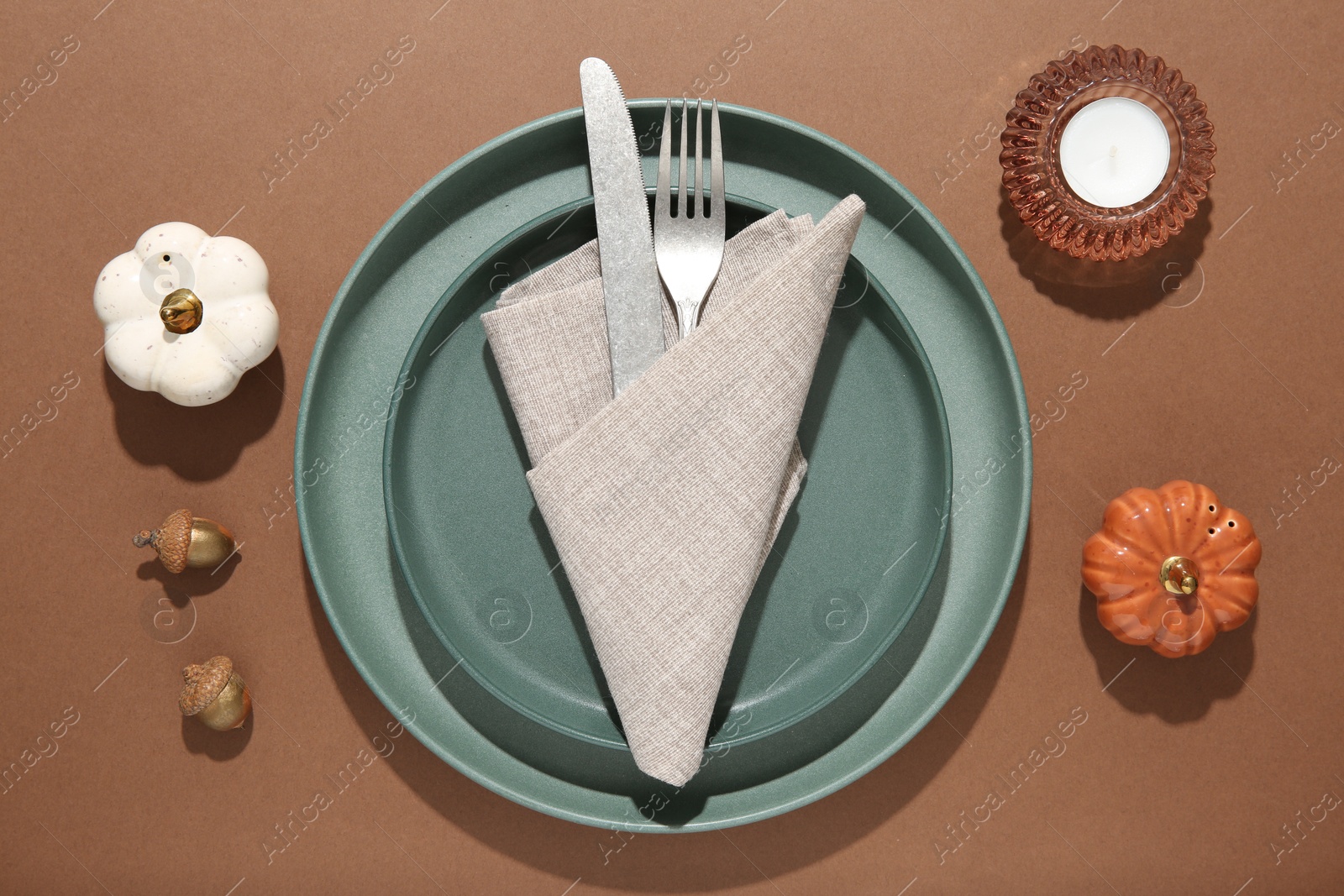 Photo of Beautiful table setting with autumn decor on brown background, flat lay