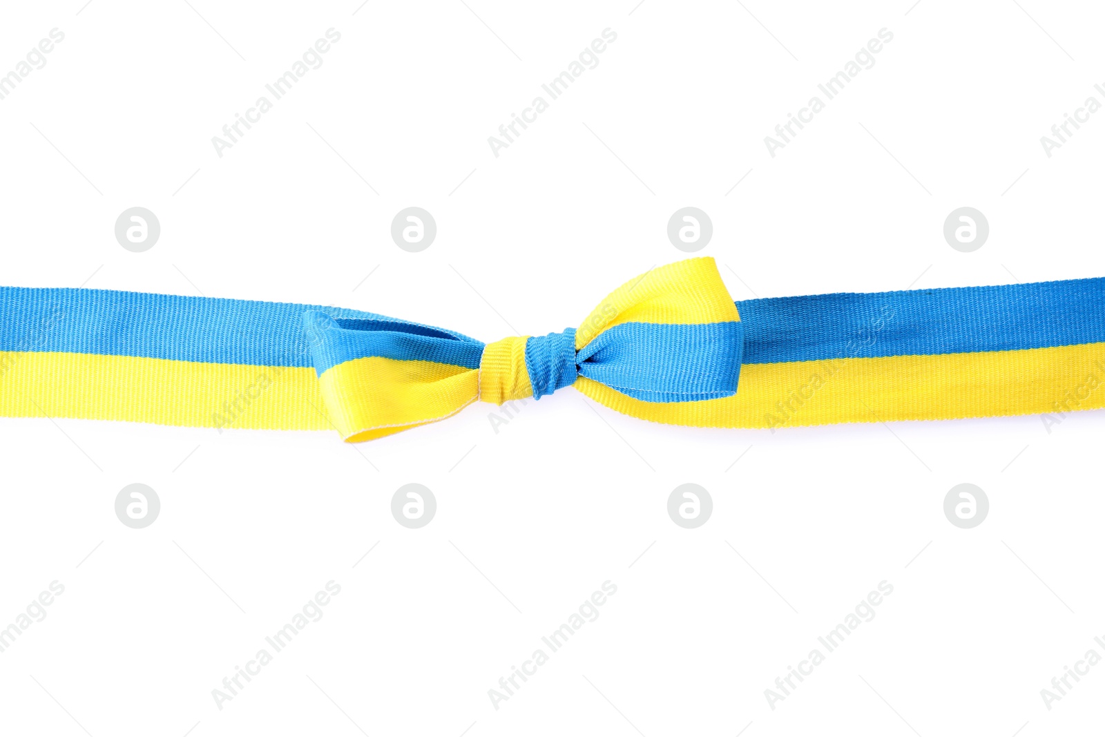 Photo of Ribbon with bow in colors of Ukrainian national flag isolated on white, top view