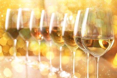 Image of Different tasty wines in glasses on table. Bokeh effect