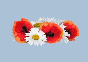 Image of Beautiful wreath of daisy and poppy flowers on greyish blue background