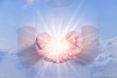 Image of Woman with holy light in hands against sky, closeup