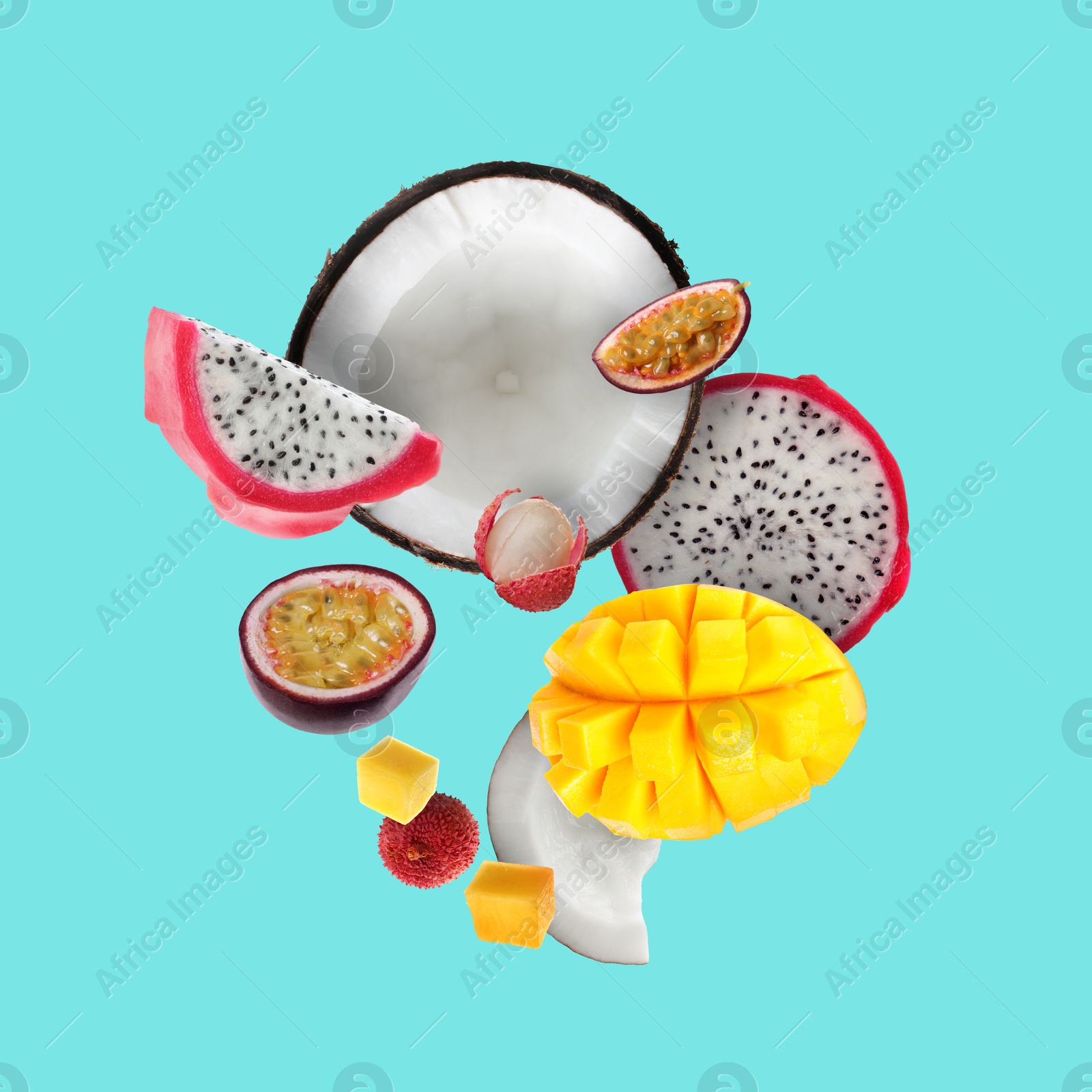 Image of Coconut, dragonfruit, mango, lychees and maracuja in air on turquoise background. Tropical fruits