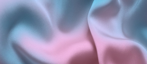 Image of Beautiful silk fabric with color gradient, top view. Banner design