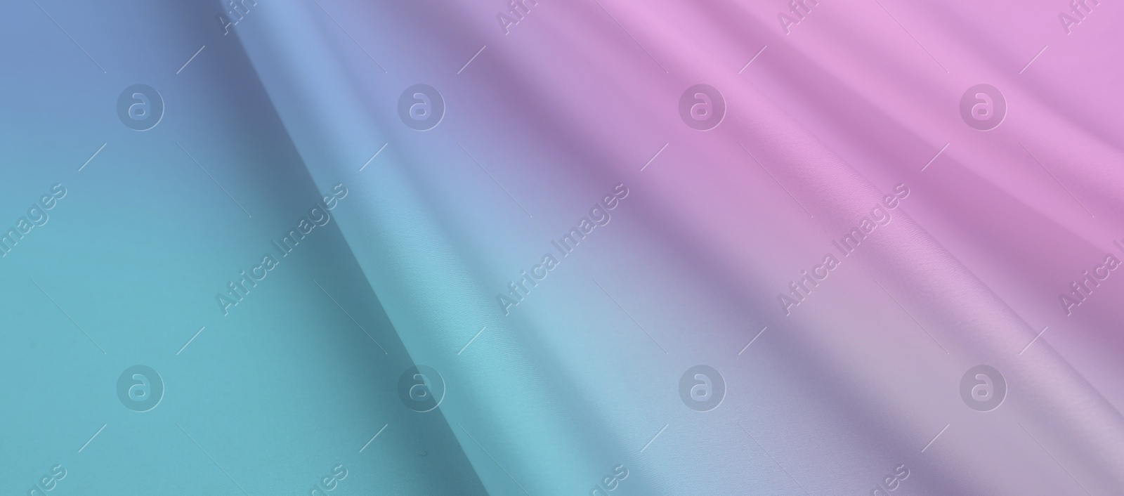 Image of Beautiful silk fabric with color gradient, top view. Banner design