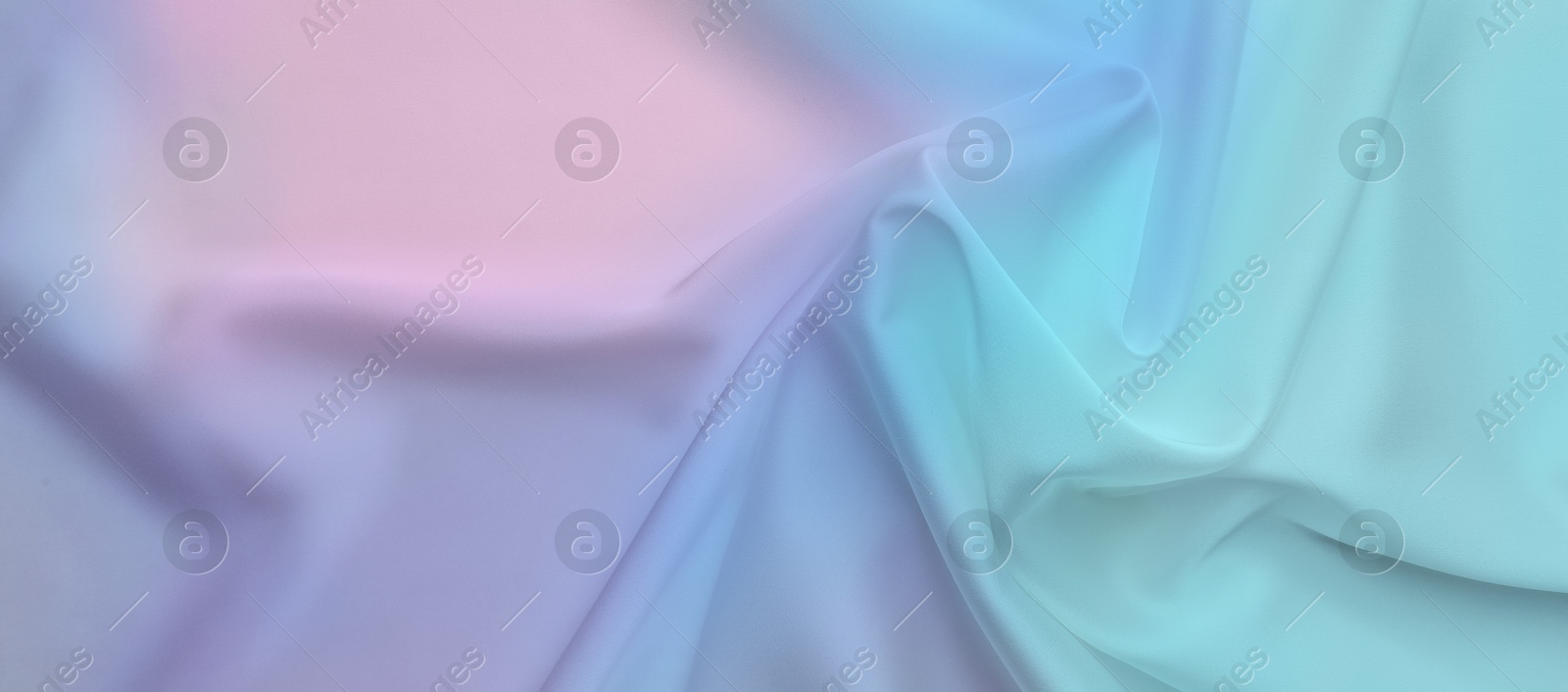 Image of Beautiful silk fabric with color gradient, top view. Banner design