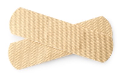Photo of Medical adhesive bandages isolated on white, top view