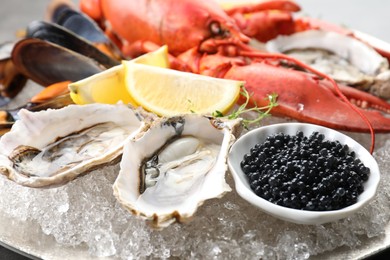 Different sea food on plate, closeup view