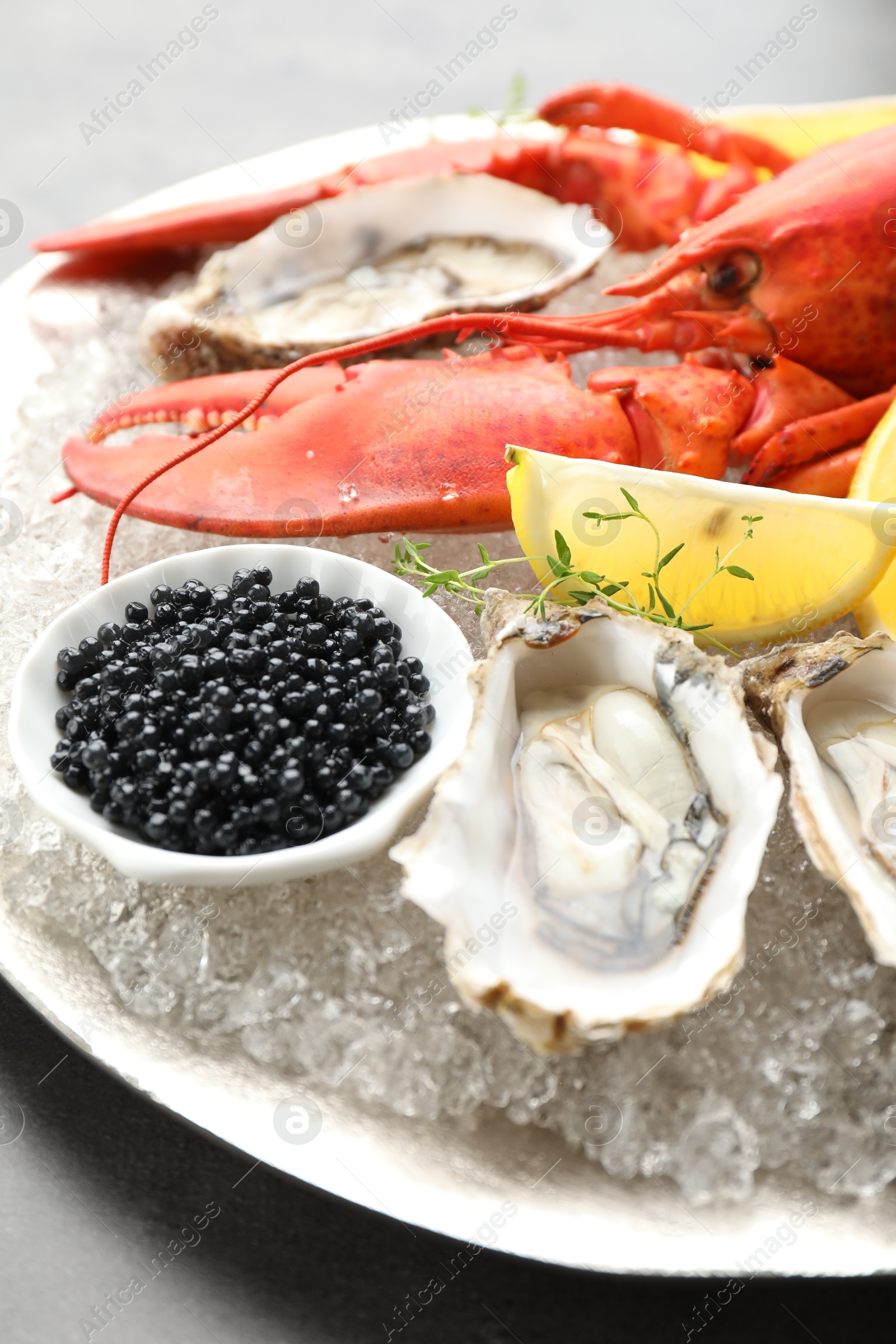 Photo of Different sea food on grey table, closeup