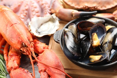 Lobster, mussels and oyster on table, closeup