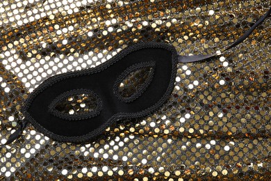 Beautiful carnival mask and fabric with golden sequins, top view