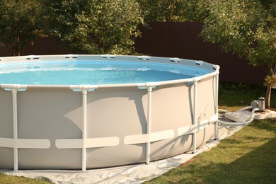 Photo of Above ground swimming pool outdoors on sunny day