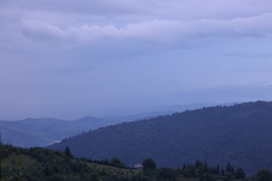 Photo of Picturesque view of beautiful mountains covered with fog