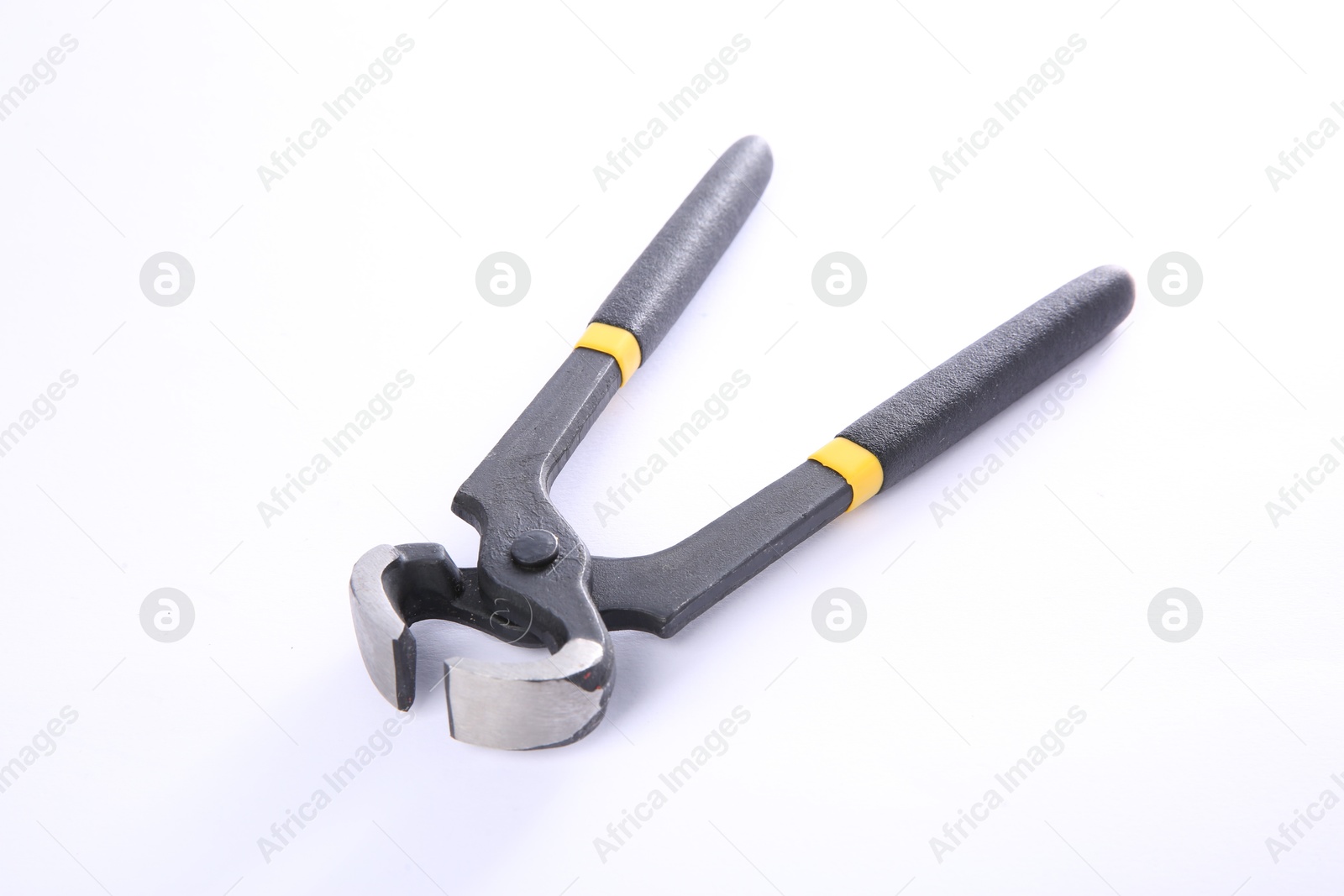 Photo of One pincers isolated on white. Carpenter's tool