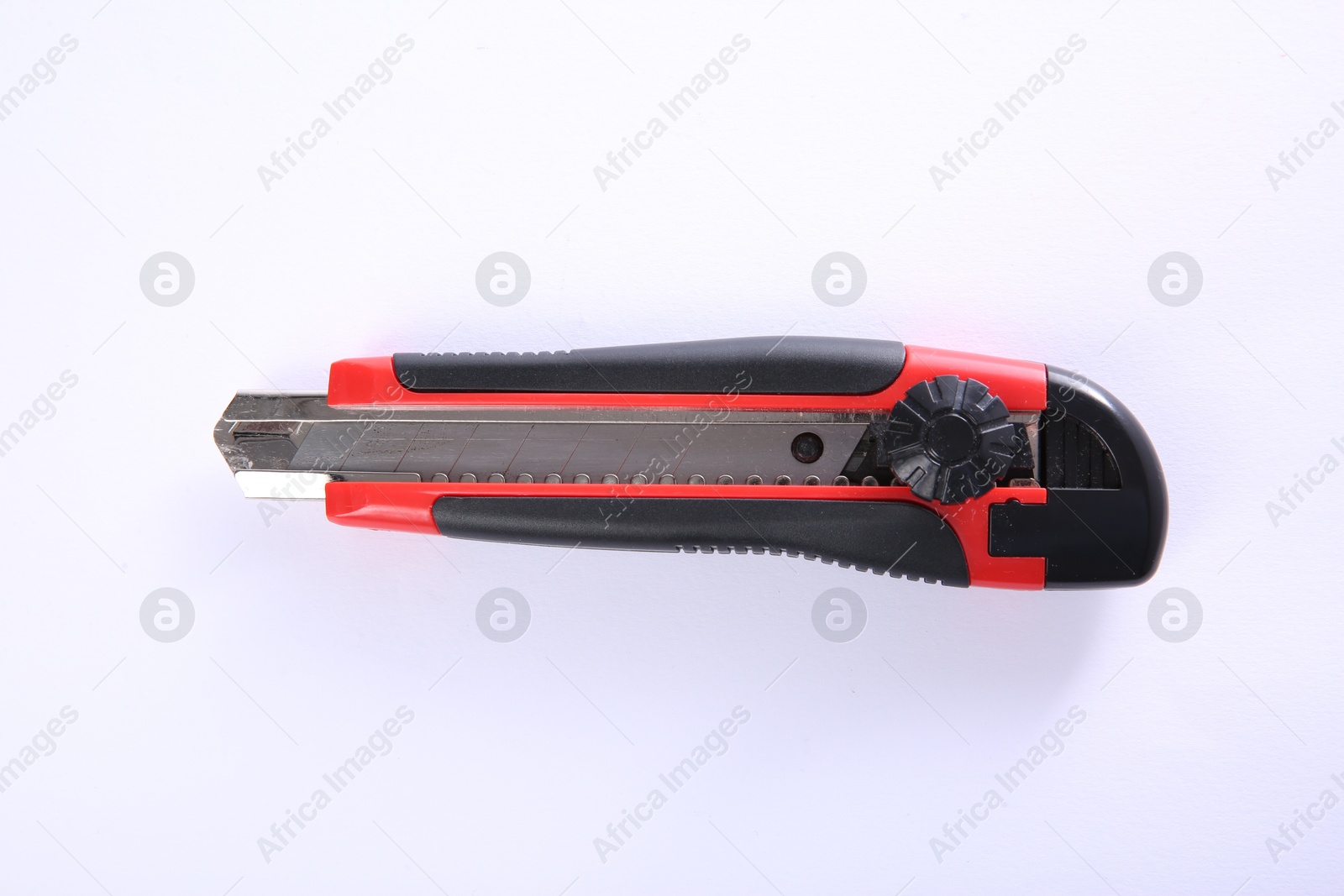 Photo of One utility knife isolated on white, top view