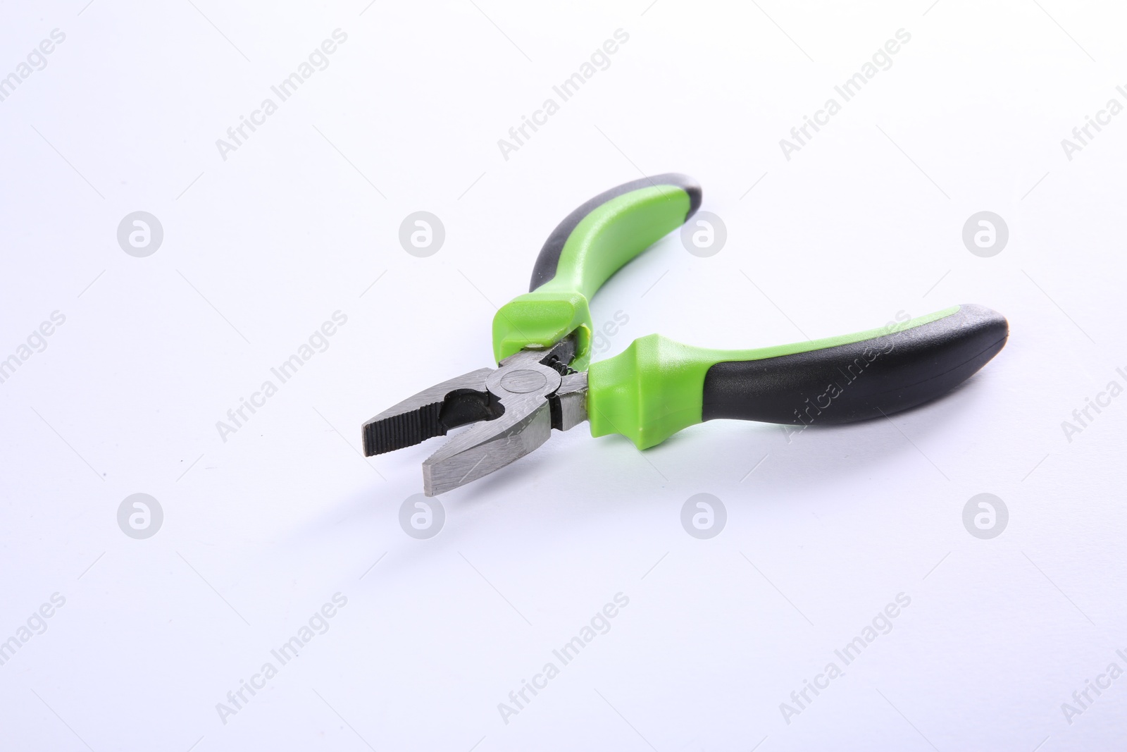 Photo of One combination pliers isolated on white. Construction tool