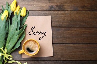 Image of Sorry card, yellow tulips and coffee on wooden table, flat lay. Space for text