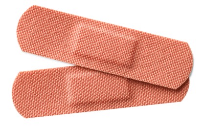 Photo of Medical adhesive bandages isolated on white, top view
