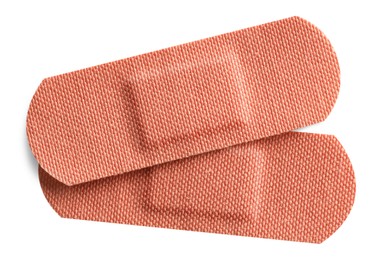 Photo of Medical adhesive bandages isolated on white, top view