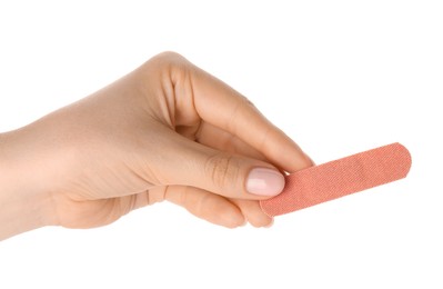 Photo of Woman holding medical adhesive bandage on white background, closeup
