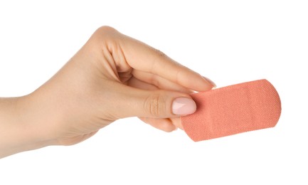 Photo of Woman holding medical adhesive bandage on white background, closeup