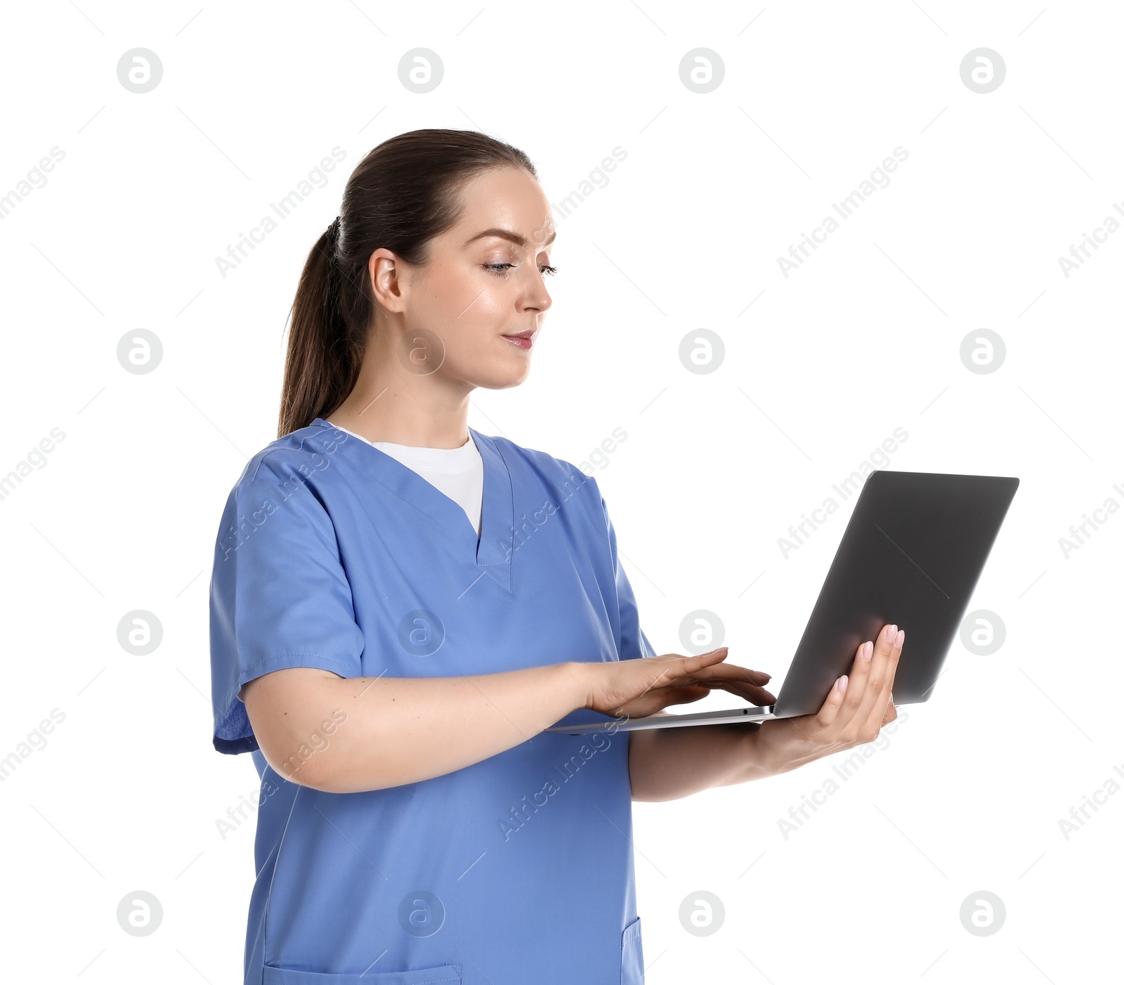 Photo of Professional nurse working with laptop on white background