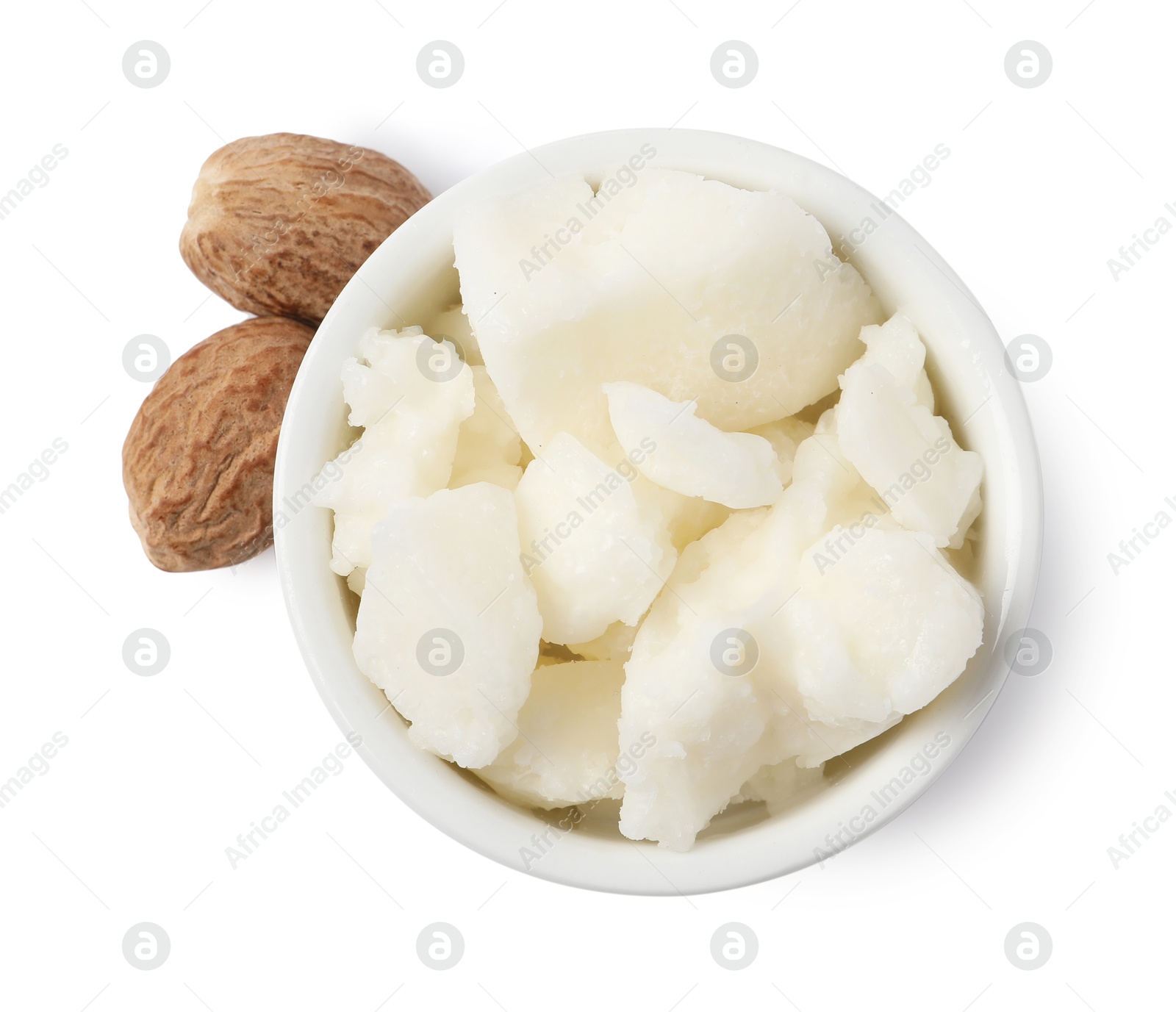 Photo of Shea butter in bowl and nuts isolated on white, top view