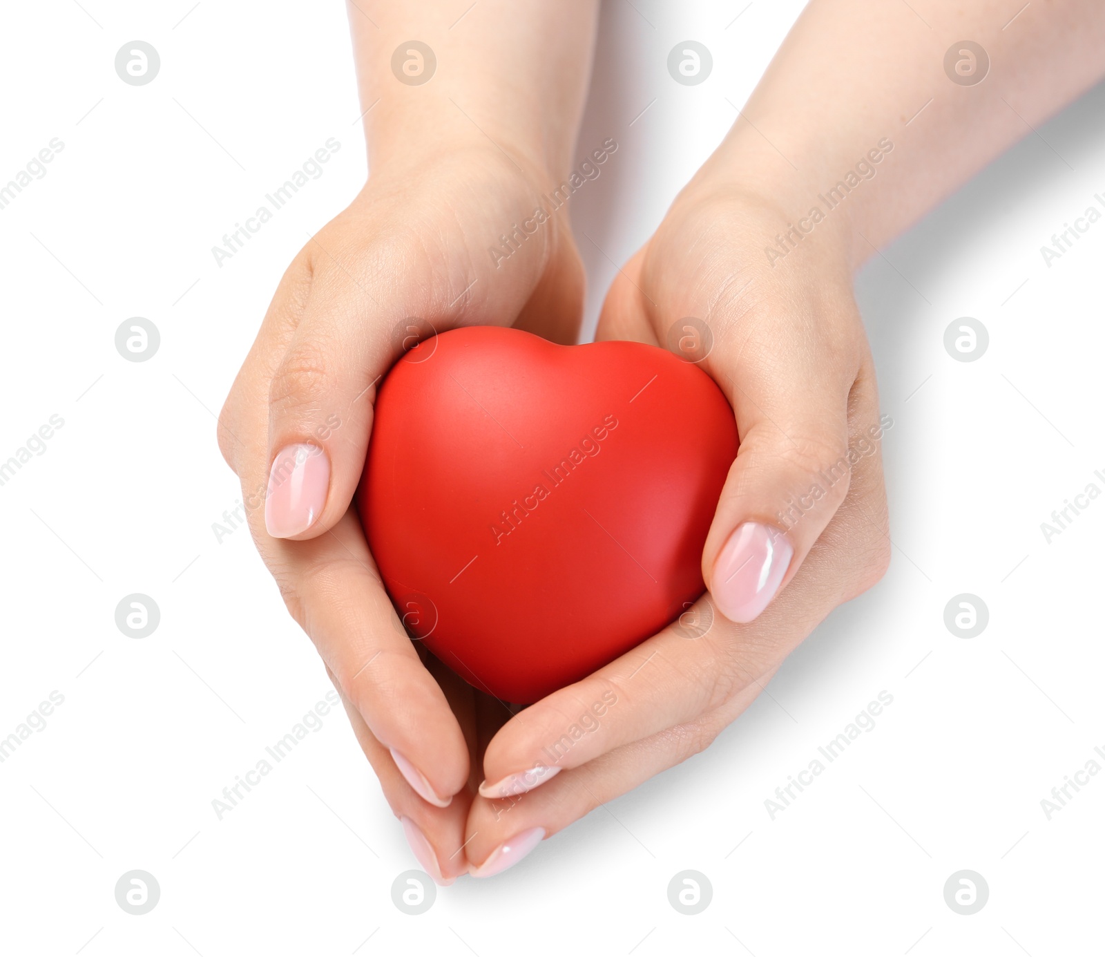 Photo of Woman with red decorative heart at white table. Space for text