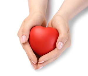 Photo of Woman with red decorative heart at white table. Space for text