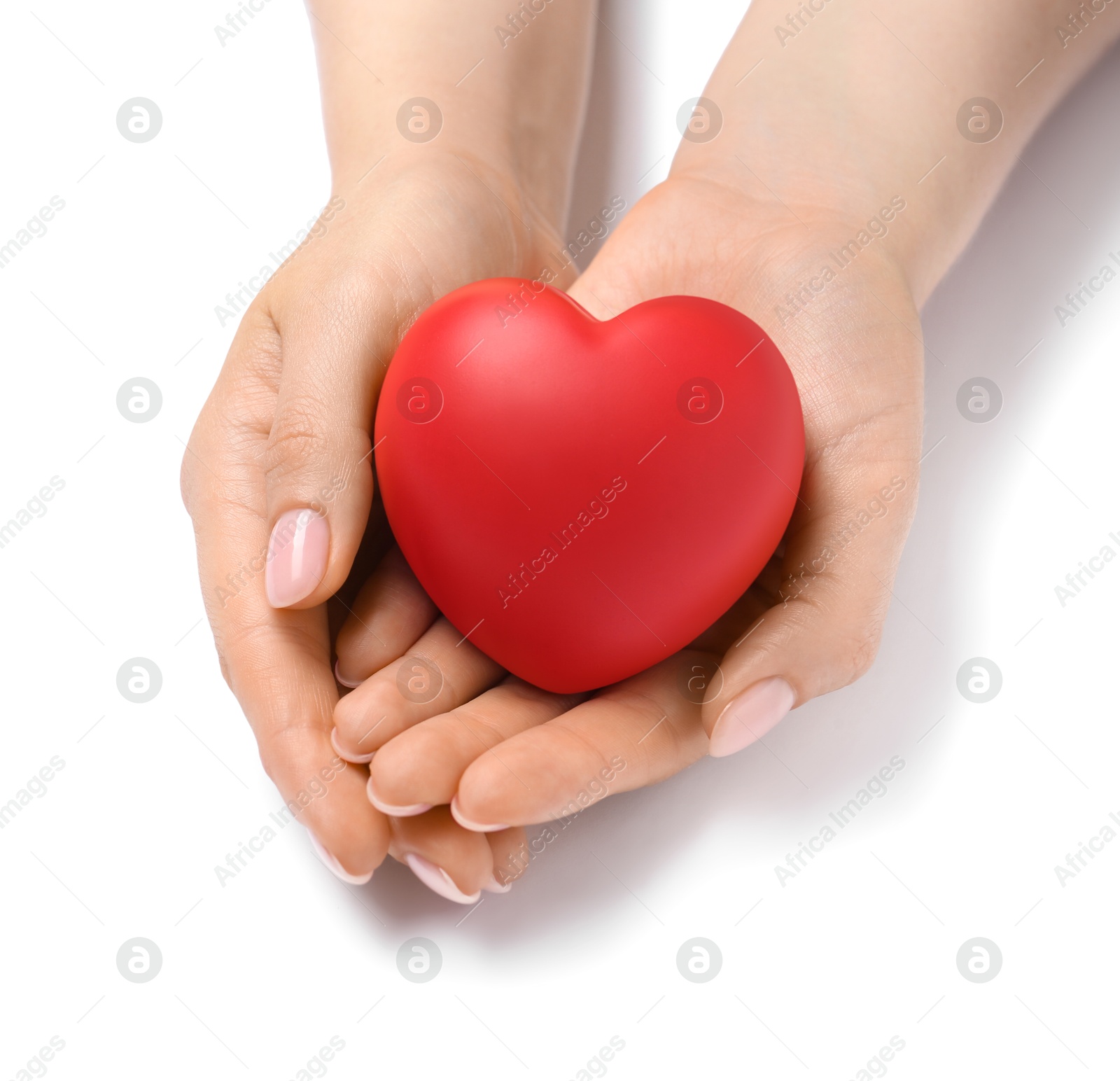 Photo of Woman with red decorative heart at white table, closeup. Space for text