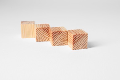 Many blank wooden cubes on white background