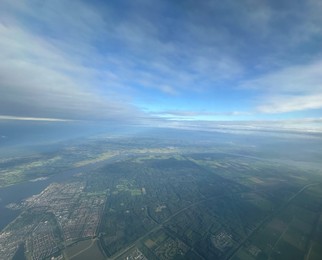 Photo of Picturesque view of city through plane window during flight