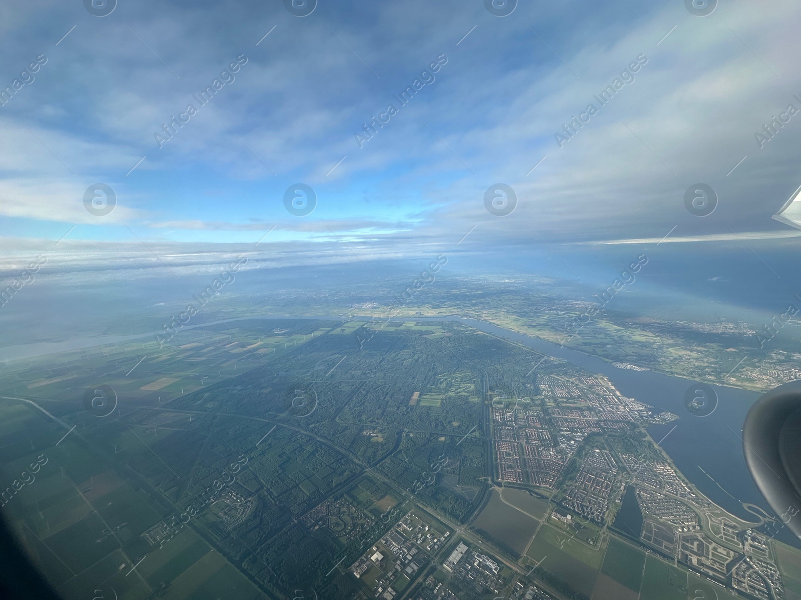 Photo of Picturesque view of city through plane window during flight