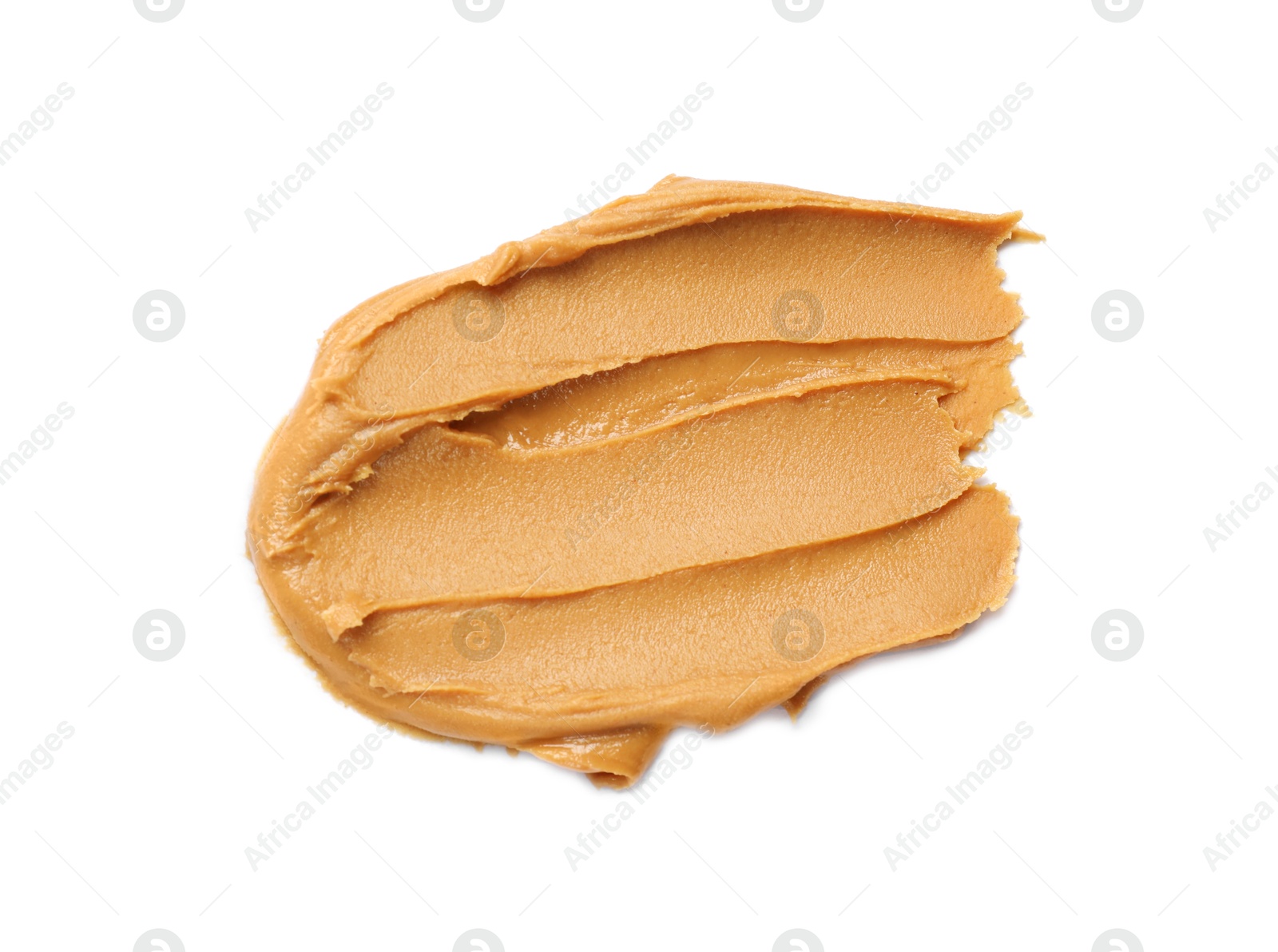 Photo of Tasty peanut butter on white background, top view