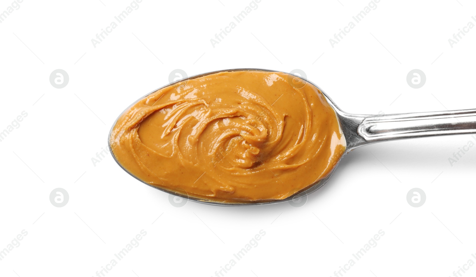 Photo of Tasty peanut butter in spoon isolated on white, top view