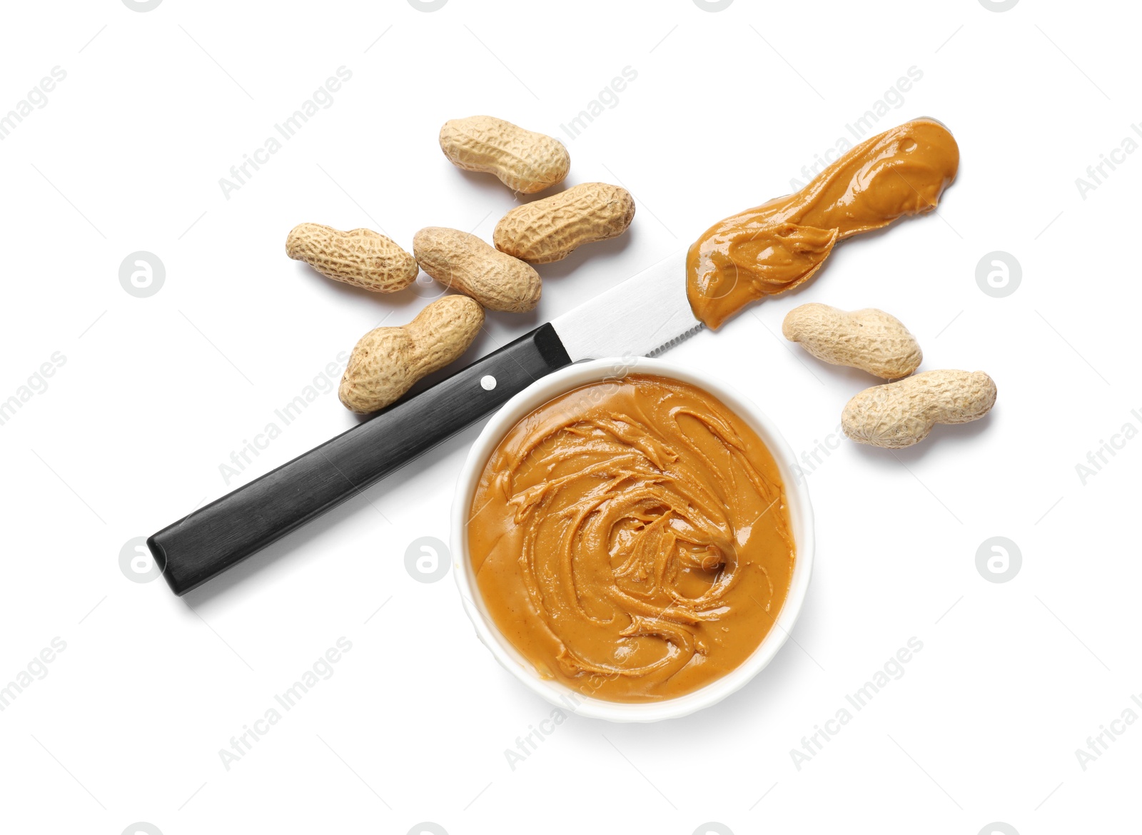 Photo of Tasty peanut butter and nuts isolated on white, top view