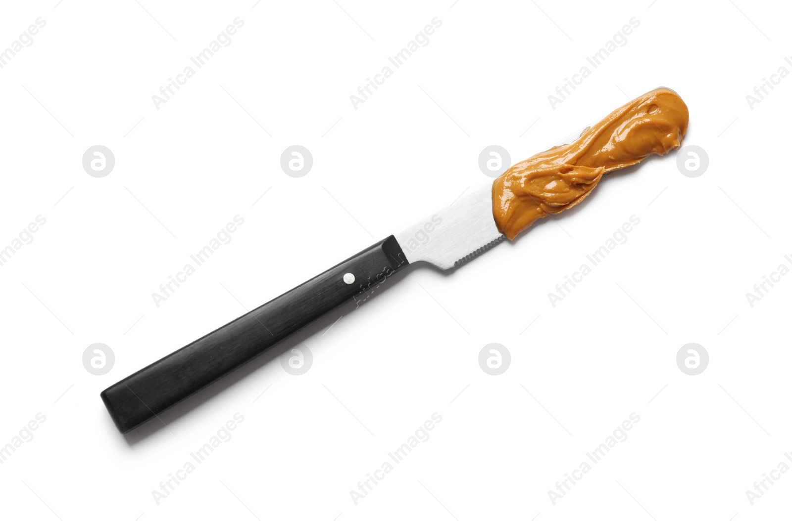 Photo of Knife with tasty peanut butter isolated on white, top view