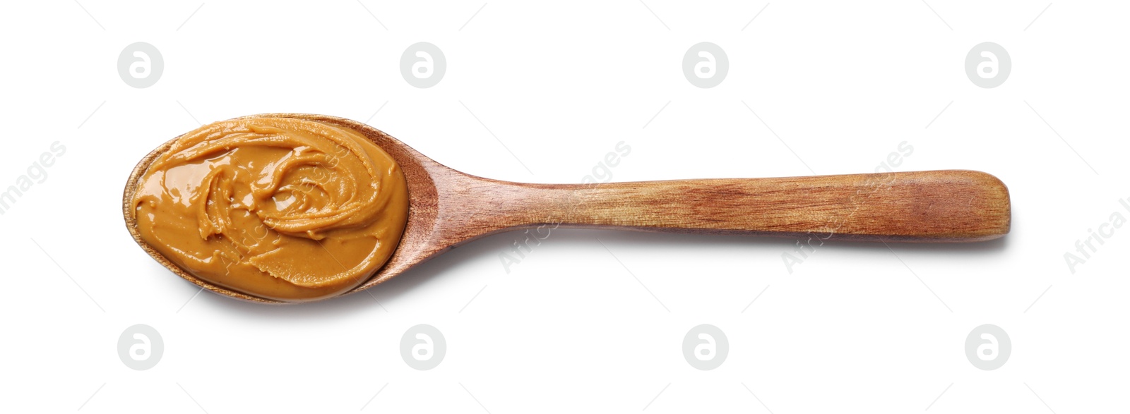 Photo of Tasty peanut butter in spoon isolated on white, top view