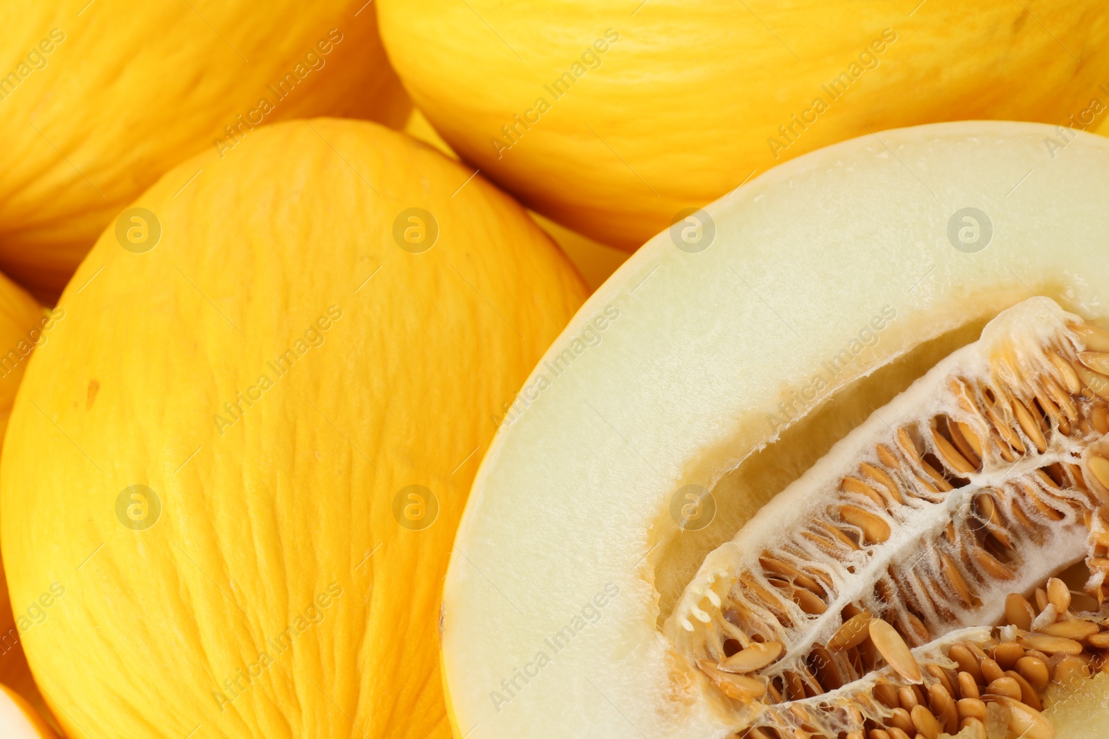 Photo of Whole and cut ripe melons as background, closeup